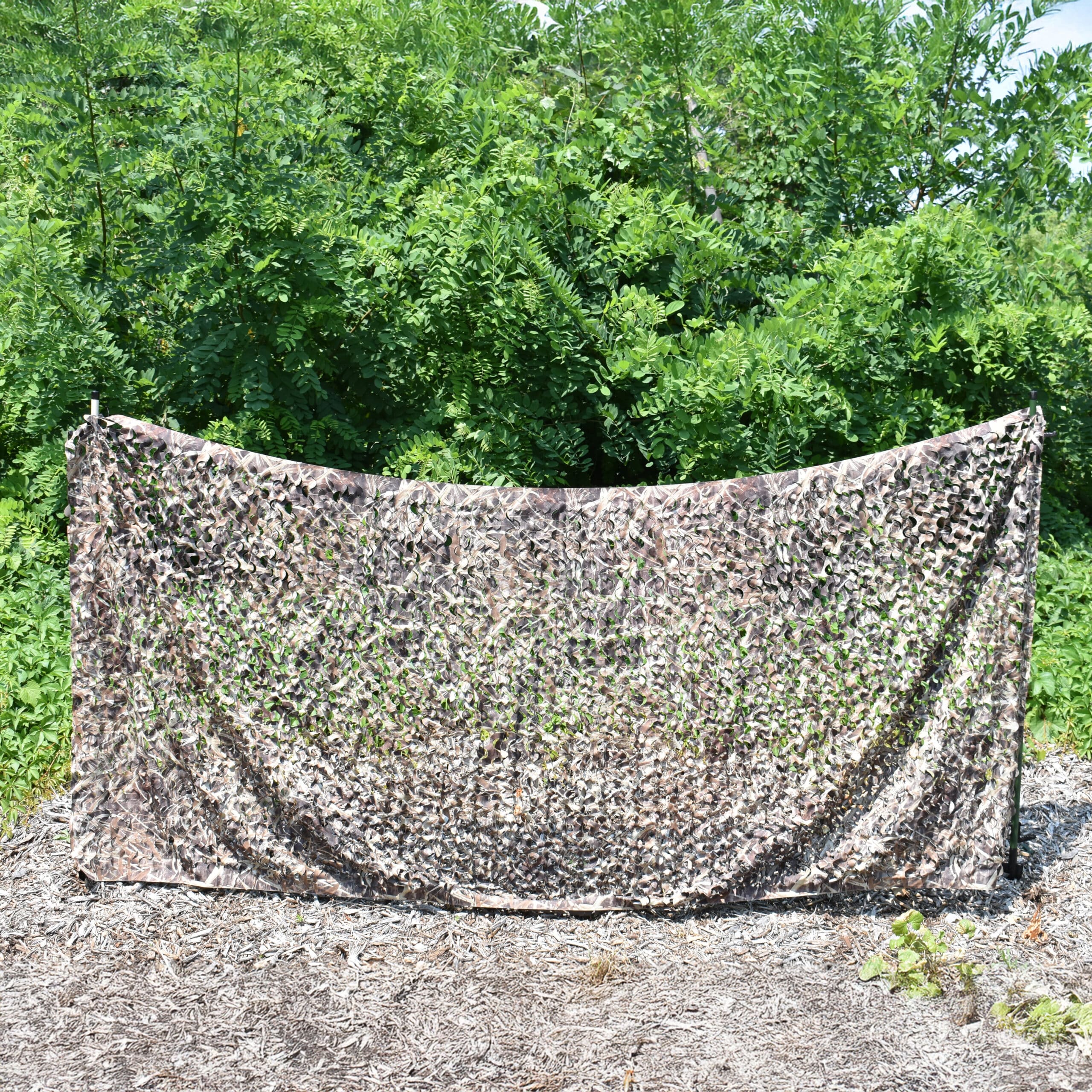 Wetland printed camo netting suspending between tow Swamp Sticks